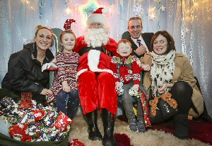 From left to right; Lauren Knights, Marketing and Communications Executive for Claire House, Ava Johnson, Santa Claus, George Johnson, Derek Millar, Commercial Director for Pyramids Shopping Centre and George and Ava�s mum Emma.