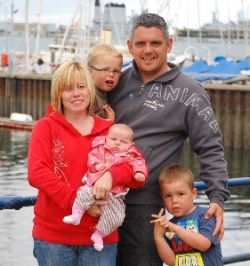 The Lawrenson family are pictured before the death of Mum, Nicola.