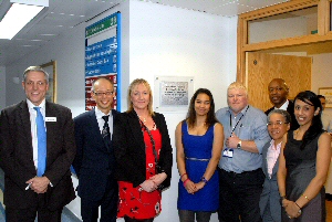 The plaque is unveiled outside the Roald Dahl Centre with chief executive Aidan Kehoe, Professor Cheng-Hock Toh, Danita Olujohungbe, Olivia Olujohungbe, Andy Houghton, Mark Walters, Professor Elizabeth Anionwu CBE, Dr Tina Dutt.