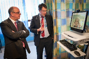 Dr Paul Fitzsimmons shows chief executive of NHS England Sir David Nicholson how the Royals stroke telemedicine service works.