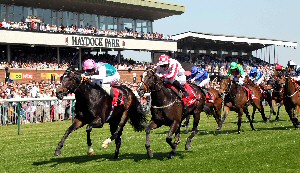 Bated Breath and jockey George Baker win the Betfred Temple Stakes from Sole Power at Haydock Park in 2012.