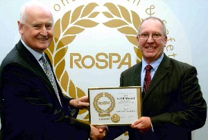 Michael Parker, CBE, RoSPA vice chairman (on left) presents the Gold Medal award to Lovell regional health and safety manager David Ashton.