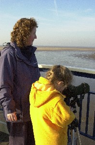 Southport Mum and her kid taking a look at the sand banks as the birds feed.