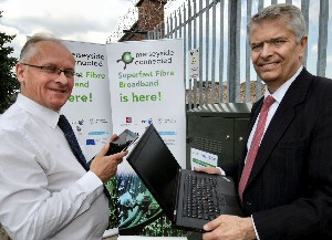 Cabinet member for regeneration, Councillor Malcolm Kennedy and Bill Murphy from BT at the completed superfast broadband cabinet in the Project Jennifer area.