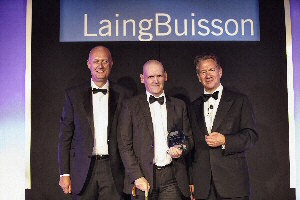 Alan Howells (centre) collects Outstanding Contribution to Care Award at the 2014 Laing Buisson Independent Specialist Care Awards, from Prof. Martin Green, CEO of Care England (left) and Rt Hon Michael Portillo (Right)