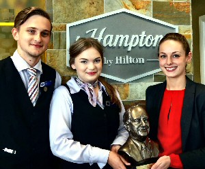 (L to R) Guest Services Managers James Brash and Beth Nolan, with Deputy General Manager Katie Park and their �Connie Award�. High resolution photograph is available on request.