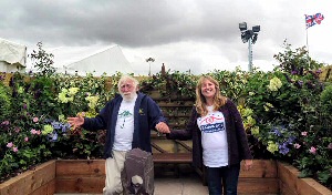 Fundraising manager Janine Bickerstaff dancing in Galloways garden with David Bellamy.