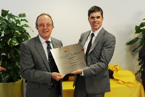 Dr Brian Haylock receives certification from James Robar.