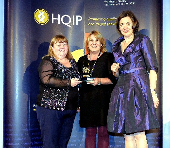 Janette Mills, Head of Audit and Effectiveness, and Matron for Performance and Standards Sue Johnson receive the Gold Award from broadcaster Vivienne Parry OBE who hosted the awards