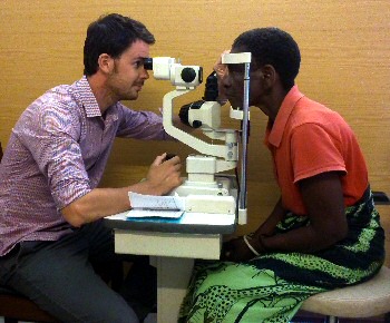 James is pictured treating patients at The Queen Elizabeth Hospital.