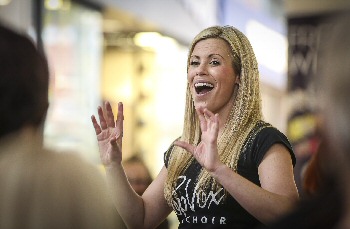 06: Emma Nowell is pictured leading the choir at Pyramids Shopping Centre.