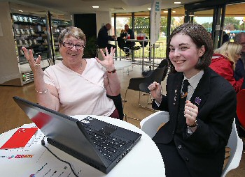Photograph caption two: Beth Anderson, 15, shows Jean Handley how to access online services via the web at the digital session at Joseph Williams Mews.