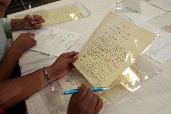Photo 2  A participant looks at an archive letter entitled 'A Petition to the Lord Mayor of Liverpool from the African Christian Association.'