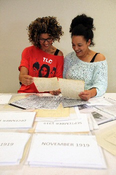 Photo 1  Sharon Lane and Janaya Pickett look at the archive.
