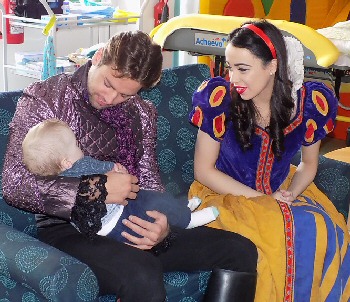 James Hill and Georgia Austin, stars of Snow White, with the children, parents and staff at Zos Place Baby Hospice in West Derby.