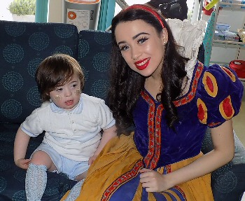  Georgia Austin, star from Snow White, with the children, parents and staff at Zos Place Baby Hospice in West Derby.