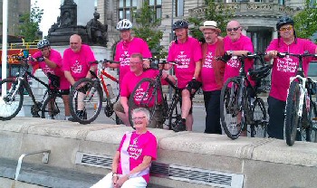 Photo caption: Steve (third left) and his team after their first bike ride for R Charity, with his wife Barbara (front)