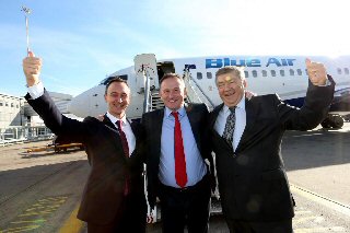 LJLA?s CEO Andrew Cornish (centre) celebrating with Blue Air?s Chief Operating Officer Tudor Constantinescu (far left) and CEO Gheorghe Racaru (far right) following the news last month that Blue Air are to make Liverpool John Lennon Airport (LJLA) their newest European base.