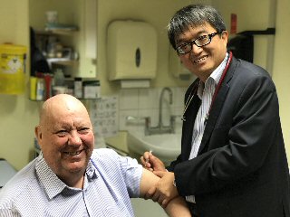The Mayor being given a flu jab by Dr Vinchi Wan Che Ho at Old Swan Health Centre