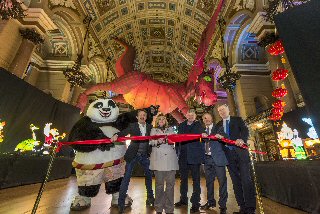 From l-r ALL LIT UP: Po the Panda; Allan Leech, Director, Heritage Brand Ventures; Cllr Wendy Simon, Assistant Mayor, Culture; Chris Brown, Director, Marketing Liverpool; Peter Johnson-Treherne, Director, Heritage Brand Ventures; Alan Smith, Manager, St Georges Hall.