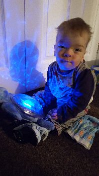 Isaac playing with some of the toys from the Play Therapy Pod.