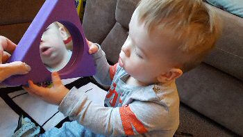 Isaac playing with some of the toys from the Play Therapy Pod.