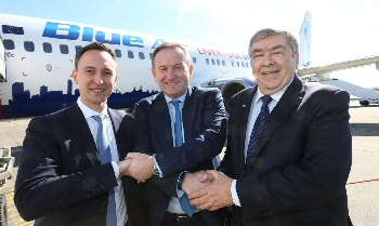 Blue Airs Chief Operating Officer Tudor Constantinescu with LJLAs CEO Andrew Cornish and Blue Airs CEO Gheorghe Racaru, celebrating the launch of the airlines latest base at Liverpool John Lennon Airport.