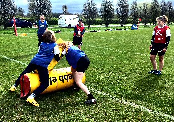 Girls take part in drills at Sale Sharks summer residential camp.