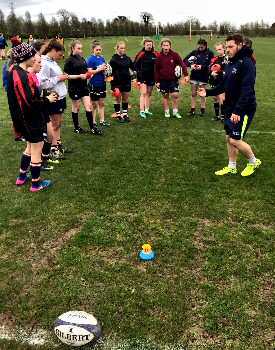 Girls take part in drills at Sale Sharks summer residential camp.