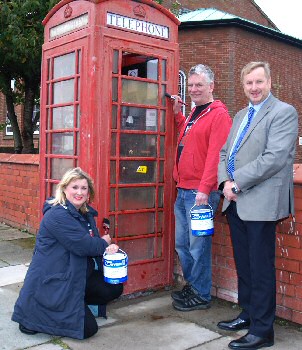 Steph McCahill and Andy Barrett from the Friends of 632 3003 ready to give the phone box a lick of paint, pictured with Cllr Stuart Whittingham.