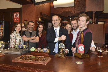 Jake Berry, Northern Powerhouse Minister, pulls a pint in the Rovers Return with the Coronation Street cast.