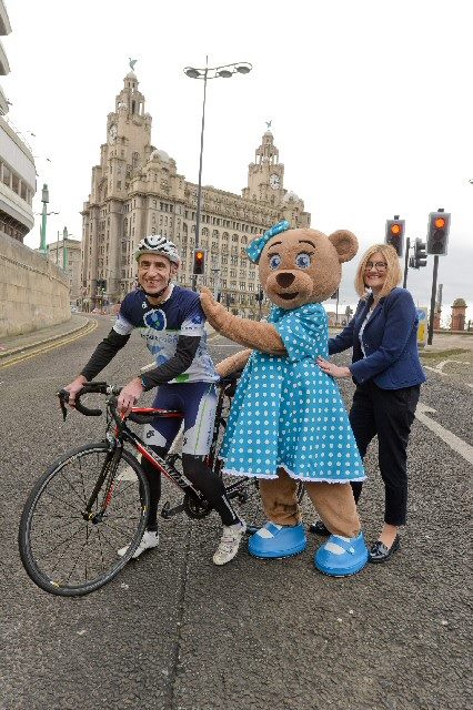 Liz Chandler, Director of Corporate Development at Merseytravel; Claire Bear, Claire House Children's Hospice Mascot; Mark Sandamas, Director of Pennine Events Ltd