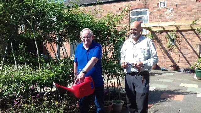 Andrew (right) and fellow mens group member Mike Rimmer enjoy a sunny spot in the garden at Southport Community Centre