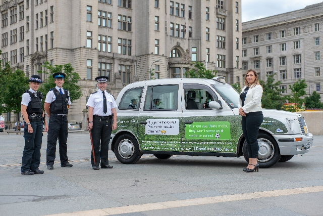 PC Rebecca Cain, PCSO Eddie McCarthy and Inspector Andy Greer from Merseyside Police with Jenny Davies from Liverpool City Councils Alcohol and Tobacco Unit and one of the branded taxis promoting Drink Less Enjoy More during the World Cup