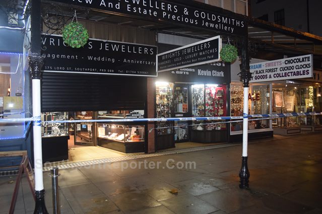 Photograph shows Police cordon tape front of Wrights Jeweller, Southports.