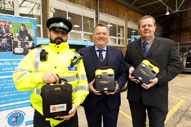 Lifesaver: Liverpool City Council Licensing Officer Aziz Musa, Mark King of the Oliver King Foundation and city council training officer Karl Lloyd with the new defibrillators.