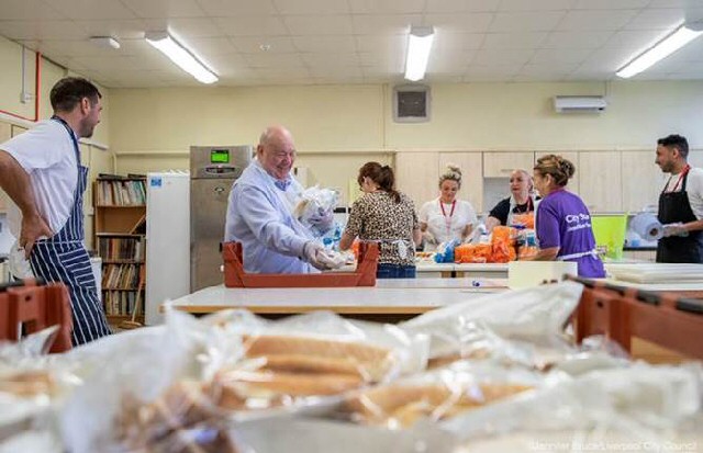 Helping Hands - Mayor of Liverpool Joe Anderson at the preparations for the Summer Lunch Club
