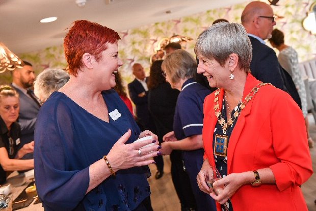 Home manager at Formby Manor Cheryl Bris (left) chats to Councillor June Burns (right.)