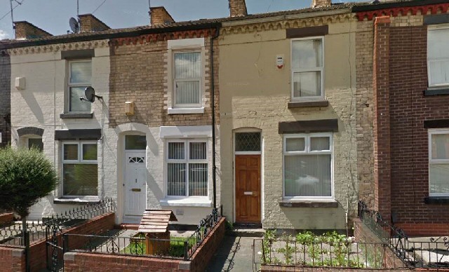 The house painted yellow with a brown door, on Ruskin Street in Kirkdale, was among the 29 unlicensed properties 