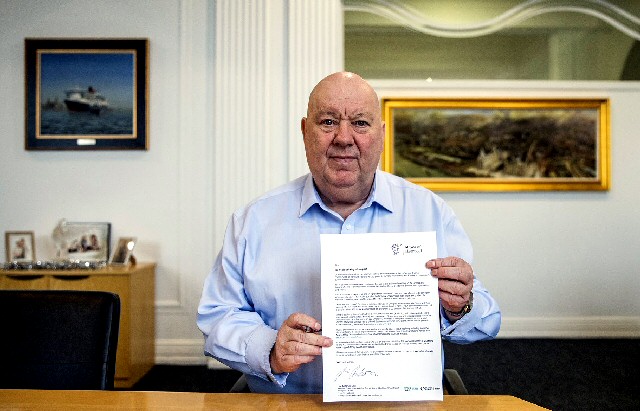 Mayor Joe Anderson holing the correspondence he has sent to EU citizens within Liverpool.