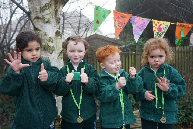 Class Act: East Prescot Road Nursery School headteacher Colette Bentley and City Council Cabinet Member for Education, Employment and Skills Cllr Barbara Murray celebrate 6 outstanding Ofsted reports with pupils.