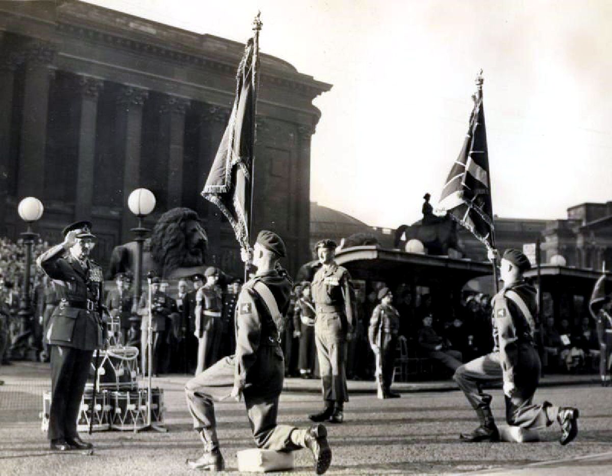 The 13th Battalion of the Parachute Regiment receive their Colours in Liverpool from Field Marshall Montgomery in 1953.